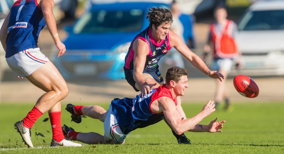 IN PURSUIT: Fletcher Seymour pays close attention to Sam Darley in the Blues' 44-point win over North Hobart. Picture: Phillip Biggs