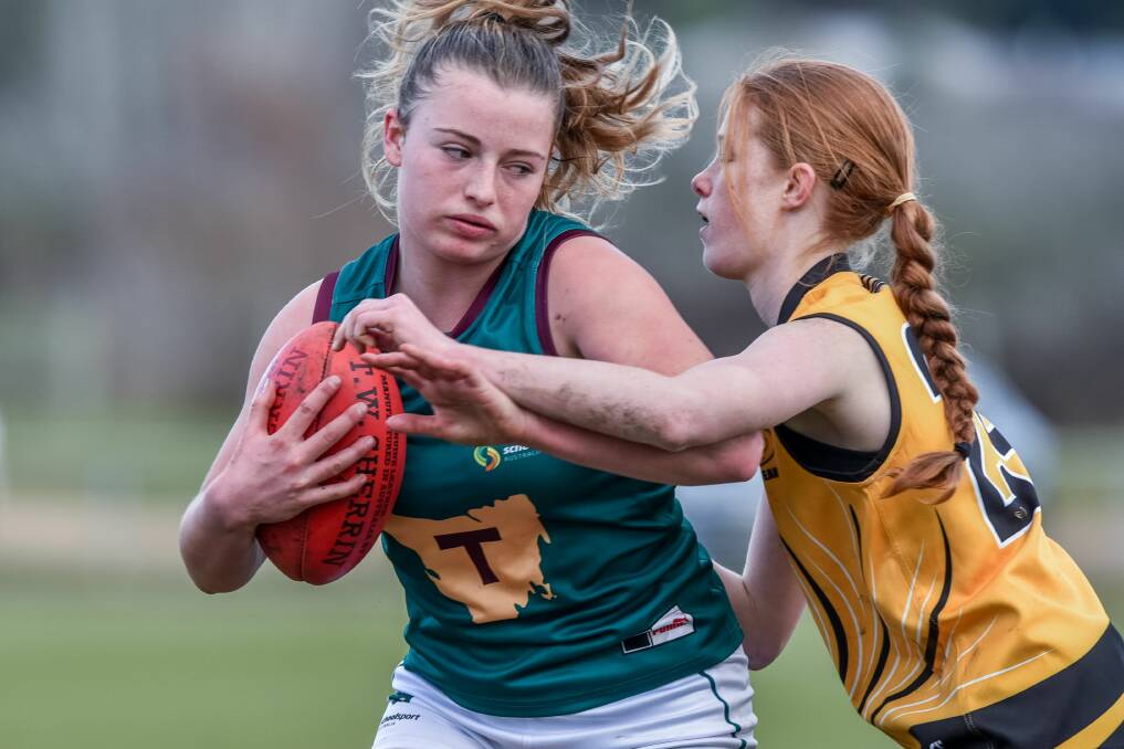 DON'T ARGUE : Liana Freestone brushes off a tackle in Saturday's loss to Western Australia. Picture: Neil Richardson