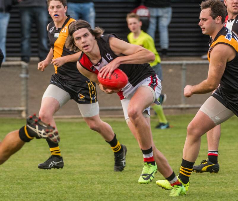 BLACK, WHITE AND RED BEACON: Young forward Chev Deacon is one of a host of young names headlining a new era at George Town. Picture: Phillip Biggs