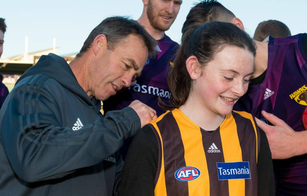 ADIOS: Exiting Hawthorn coach Alastair Clarkson signs Bella Street's guernsey in Launceston. Picture: Phillip Biggs
