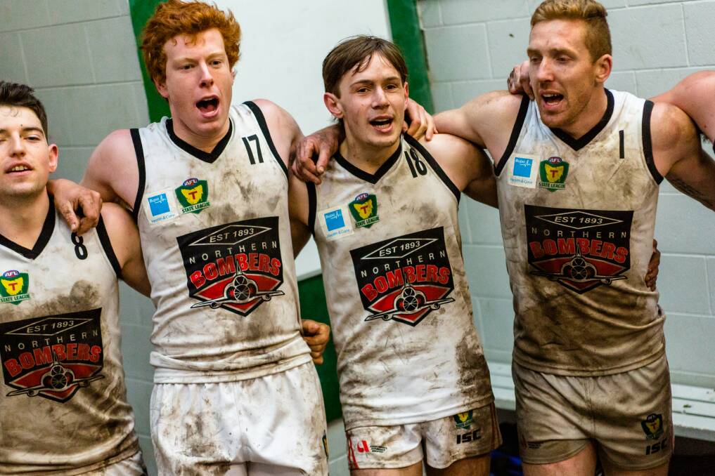 CHORUS: Ben Simpson, Tom Donnelly, Rhyan Mansell and Brad Cox-Goodyer belt out the song post-game. Picture: Solstice Digital