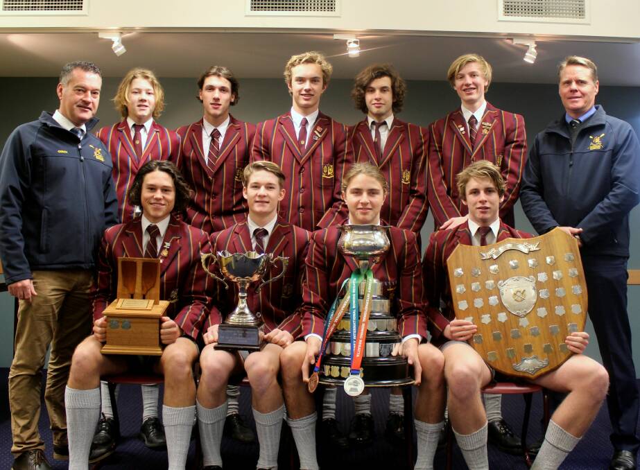 TROPHY-LADEN: The Scotch Oakburn senior boys' rowing squad with head coach James Russell and director Jamie Breden. Picture: Hamish Geale