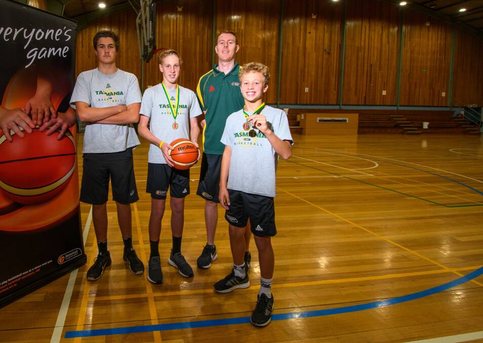 BACK WITH A BANG: Junior representative basketballers Hayden Zasadny, Lachlan Brewer and Max Hollister with Northern development officer Darren Best. Picture: Scott Gelston.