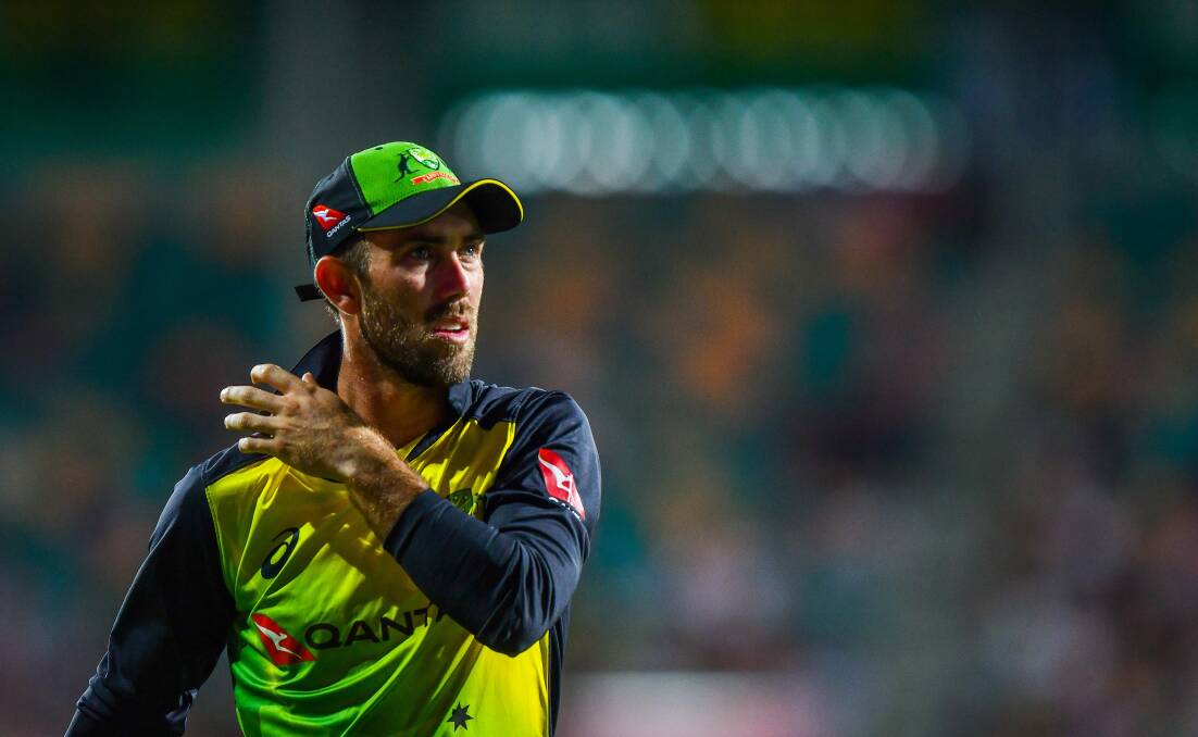 THE GREAT ALL-ROUNDER: Glenn Maxwell proved he's every bit as good a firefighter as he is cricketer in Launceston on Monday. 