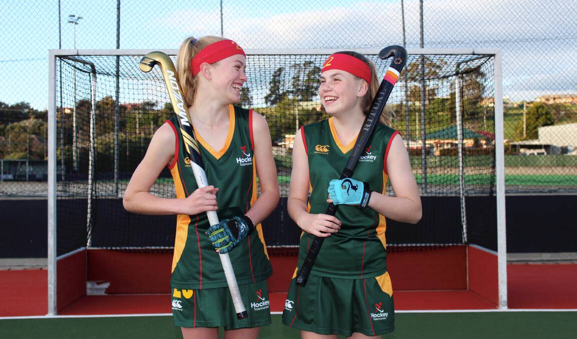 GOOD MATES: Tasmanian under-13 hockey representatives Chloe White and Shelby Steward share a laugh together. Pictures: Hamish Geale 