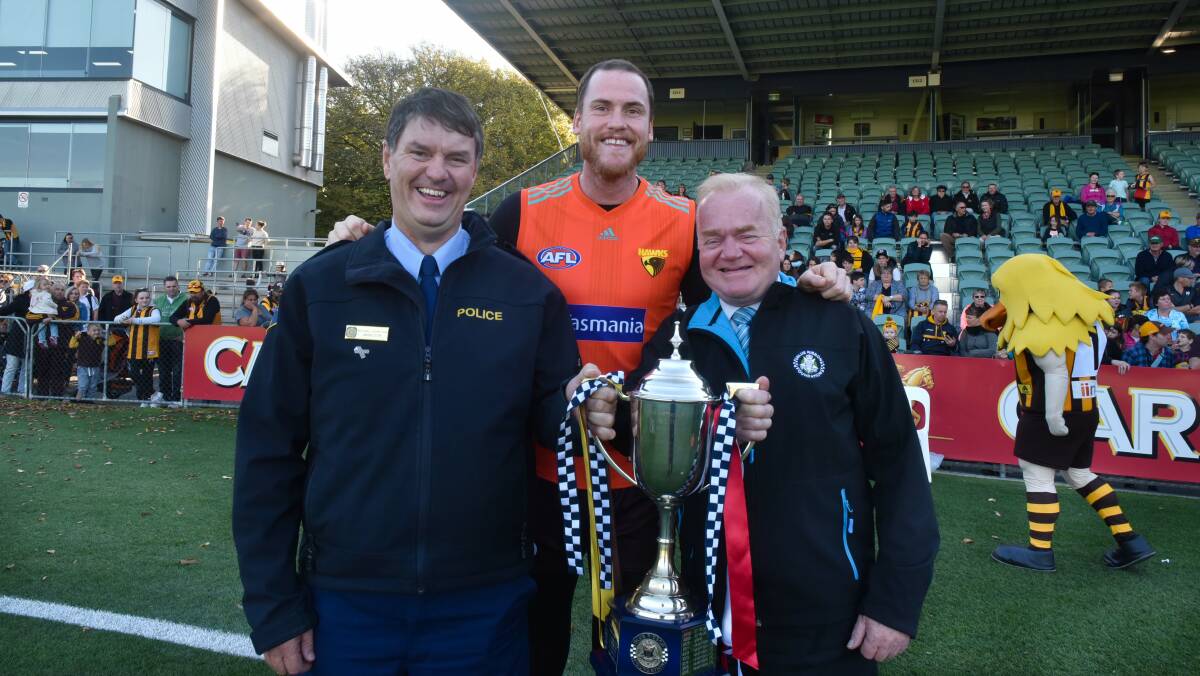 CUP CAUSE: Tasmania Police Inspector Michael Johnson, Hawthorn captain Jarryd Roughead and Victoria Police Blue Ribbon Foundation executive Neil Soullier. Picture: Neil Richardson