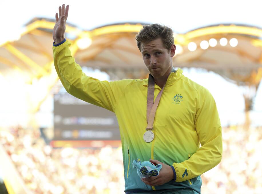 SALUTE: Hamish Peacock on the podium. Picture: AP