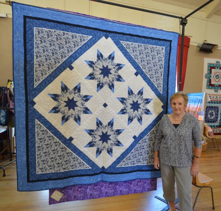 ALL SQUARE: St Helens' Glenda Aubury at Break O'Day Stitchers' annual Quilting and Embroidery exhibition. This year's exhibition wraps up on Monday. 