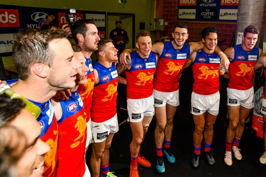 BIG DAY: Brisbane sing the song after a big win in Launceston. Pictures: Scott Gelston 