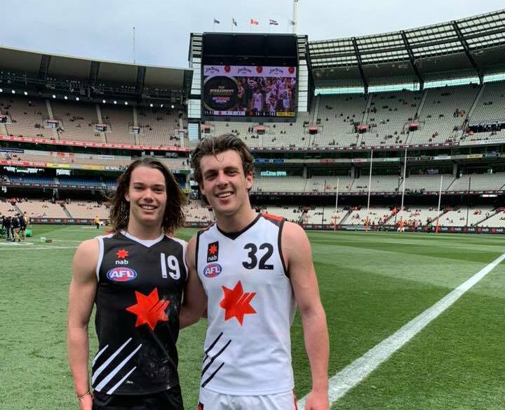 FRIENDLY FOES: Sam Collins and Jackson Callow meet on the MCG. Picture: Facebook 
