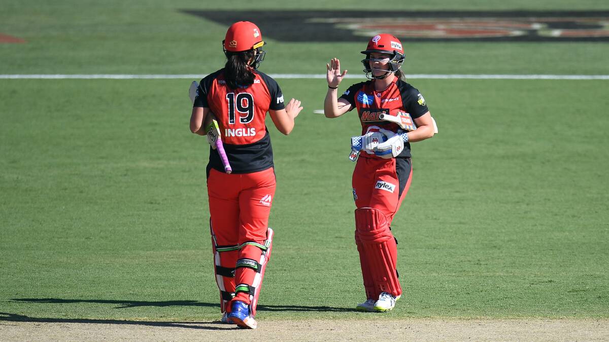 NAILED IT: Melbourne Renegade Courtney Webb celebrates a five-wicket win over Hobart Hurricanes with teammate Emma Inglis. Pictures: AAP