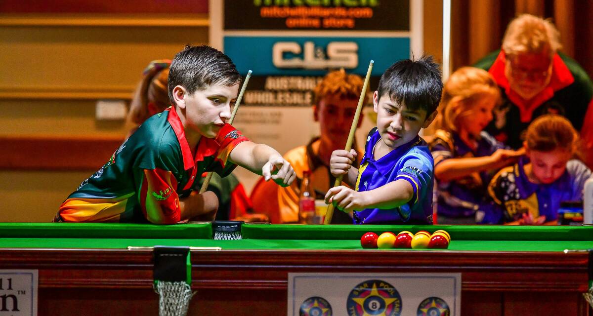 WORKING THE ANGLES: Nile's Alex Rigby and the ACT's Mau Tamehana talk tactics at the national junior eightball championships at Country Club Tasmania. Pictures: Scott Gelston