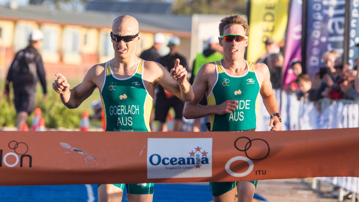 CHAMPION: Jonathan Goerlach and guide Simon Hearn cross the line first in the para-triathlon. Picture: Epic Events and Marketing. 