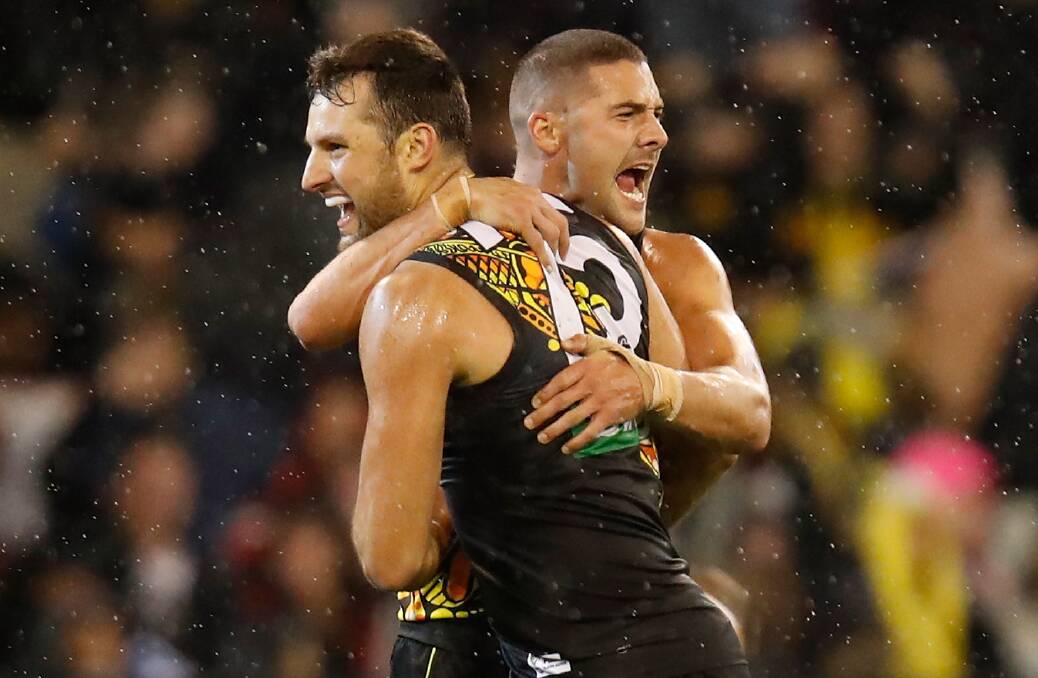 MATCH WINNER: George Town's Toby Nankervis is embraced by team mate Shaun Grigg after kicking the sealer. Picture: Getty Images. 