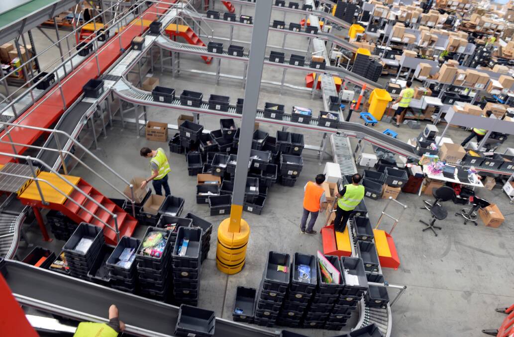 Catch.com.au has a massive warehouse in Truganina that employs the use of robots to help sort and pack items so you get your goods faster. Pic Penny Stephens, The Age.