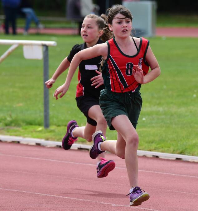 IN FRONT: Sacred Heart's Claudia Kirk leads the grade 4 girls 70m race. 