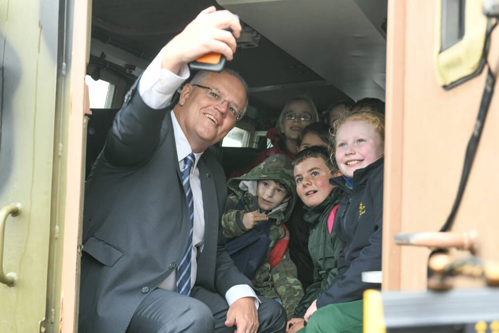 SMILE: Prime Minister Scott Morrison takes a selfie with school children at Agfest. 