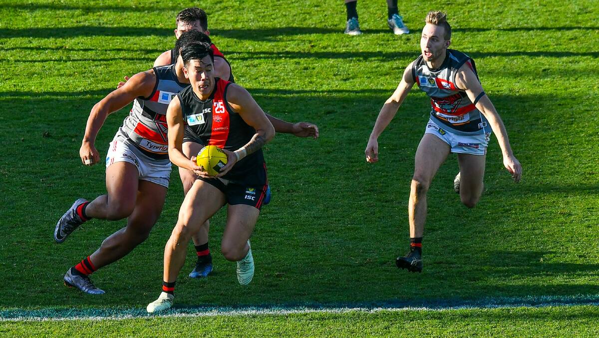 North defender Michael Tang gains a posession as North Launceston take on Lauderdale in a battle of the Bombers at UTAS Stadium. Picture: Scott Gelston
