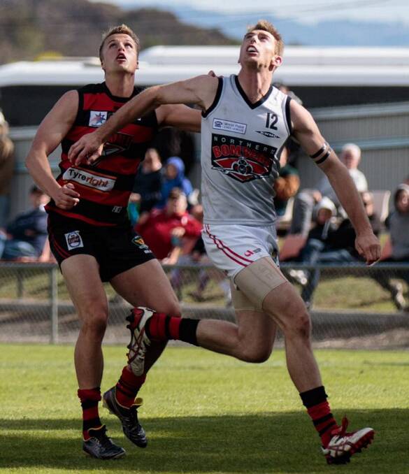 BACK IN BUSINESS: North Launceston ruck-forward Bart McCulloch in action for the Bombers against Lauderdale in round 1. It was the 26-year-old's first match in almost two years following a torn ACL. Picture: Andrew Woodgate