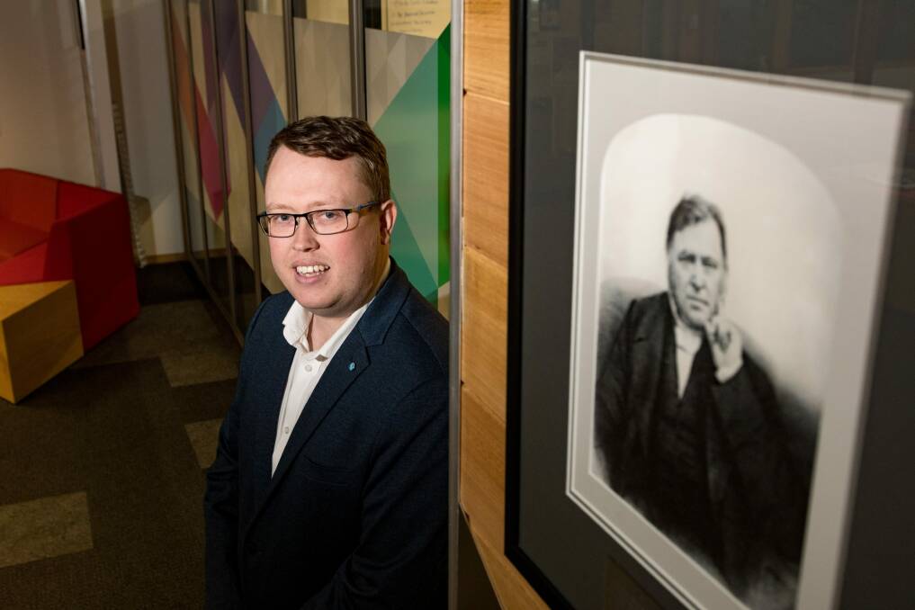 Appointed: Editor Corey Martin with a portrait of Examiner co-founder John West, which hangs proudly at the masthead's Launceston office. Picture: Phillip Biggs