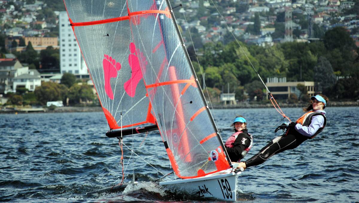 Chloe fisher on the trapeze with her previous skipper Samantha Bailey steering a 29er skiff of the Derwent. Picture: Angus Calvert