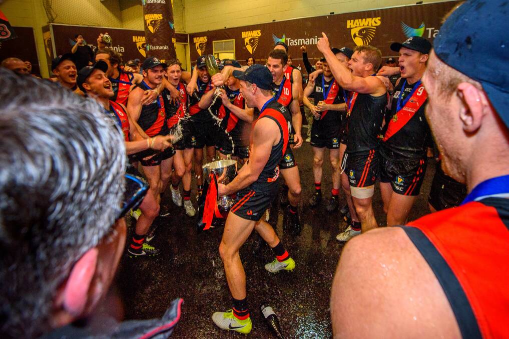 HOW SWEET IT IS: North Launceston players celebrate their grand final victory over Lauderdale in September.
