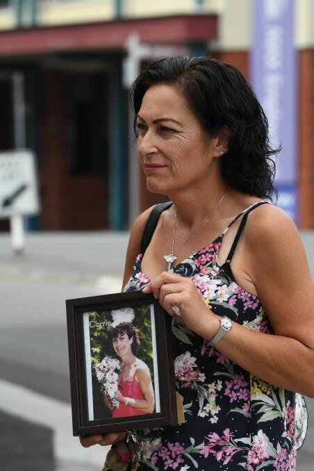 Tammy Stone, of Hobart, with picture of sister Corrie Stone leaves court. Picture: Neil Richardson