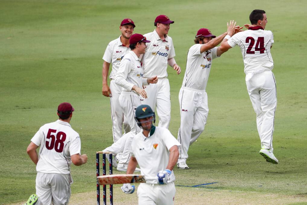 OUT: Jack Wildermuth (24) of the Bulls celebrates with teammates after taking the wicket of Beau Webster. Picture AAP