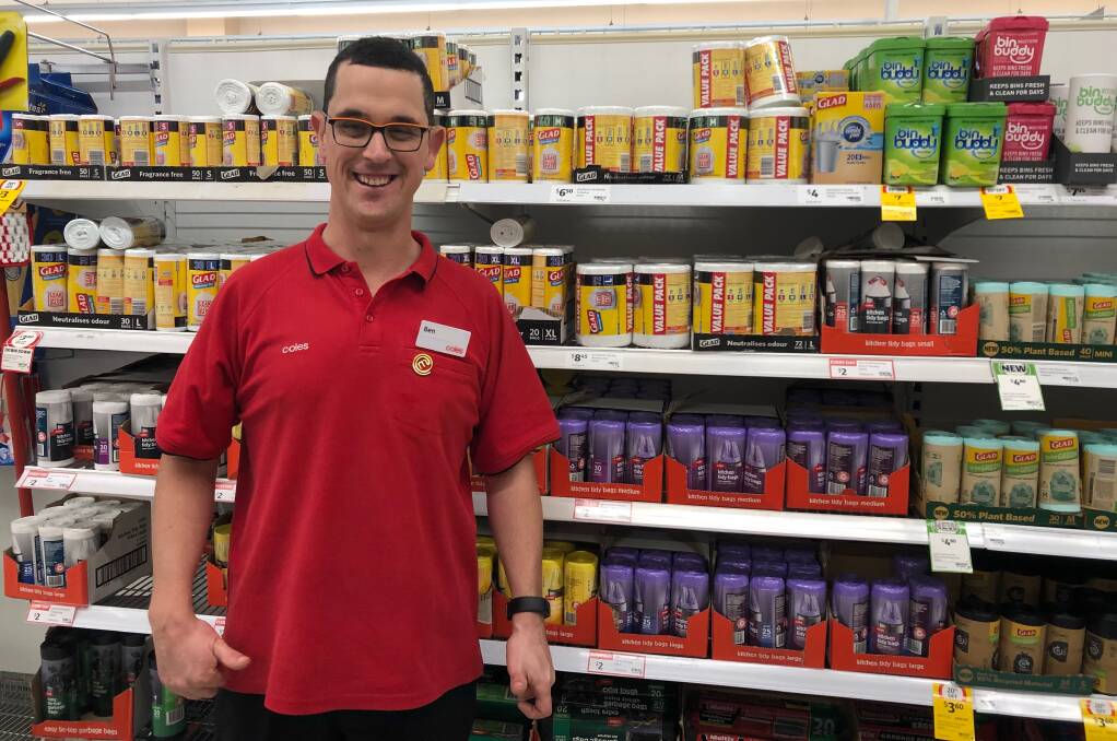 HAPPY: Ben Gower has a permanent job at Coles which he loves and is adored by the customers and staff. Picture: Supplied
