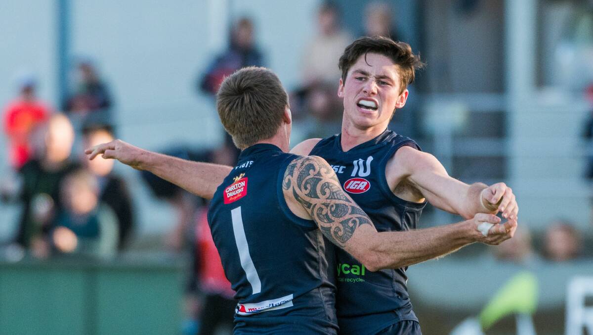 EXCITED: Chayce Jones celebrates a goal at Windsor Park with former Launceston teammate Dylan Riley. Picture: Phillip Biggs