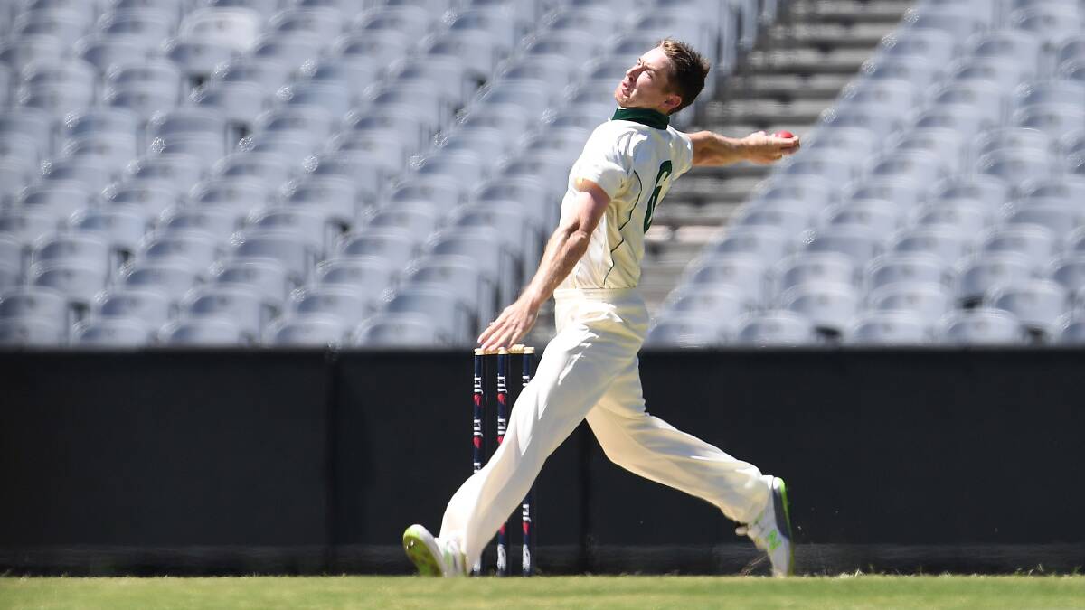 GOOD PICK UP: Tigers bowler Tom Rogers in action. Picture: AAP