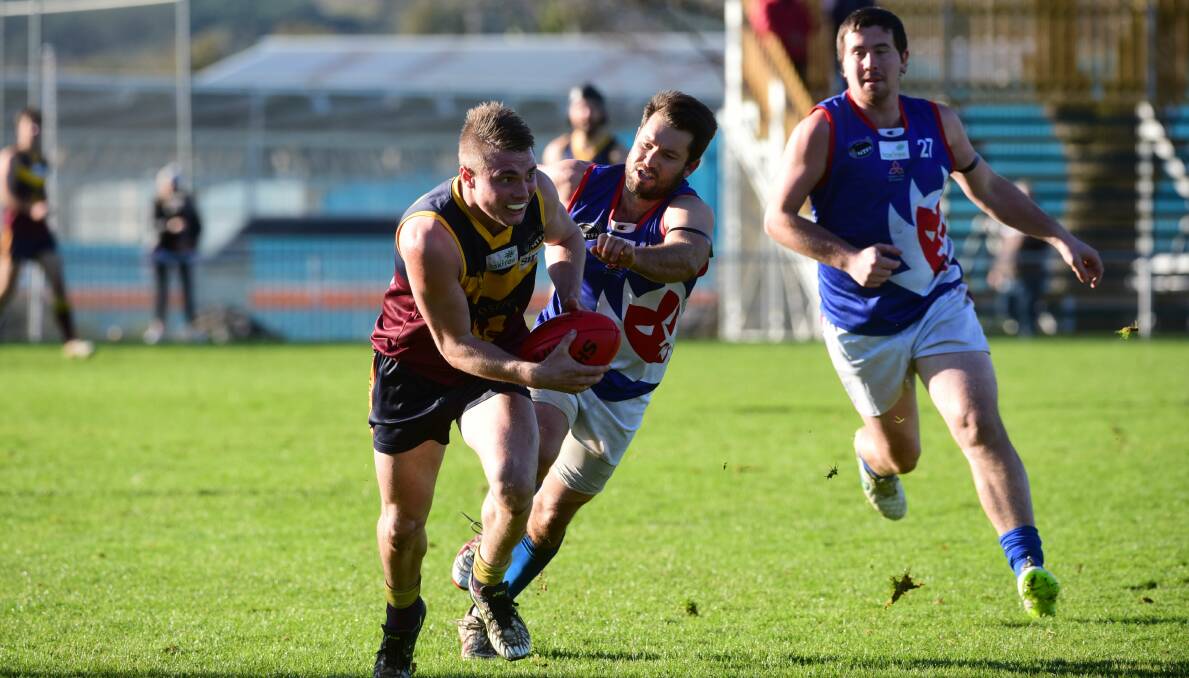 CLASS: Old Scotch's Josh Frankcombe breaks away from Lilydale's Ben Wheeler on Saturday. Picture: Paul Scambler.
