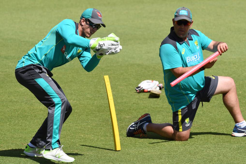 IN DEMAND: Australian coach Darren Lehmann and wicketkeeper Tim Paine during a training session at the WACA ahead of the 3rd Ashes Test in Perth. Picture: AAP