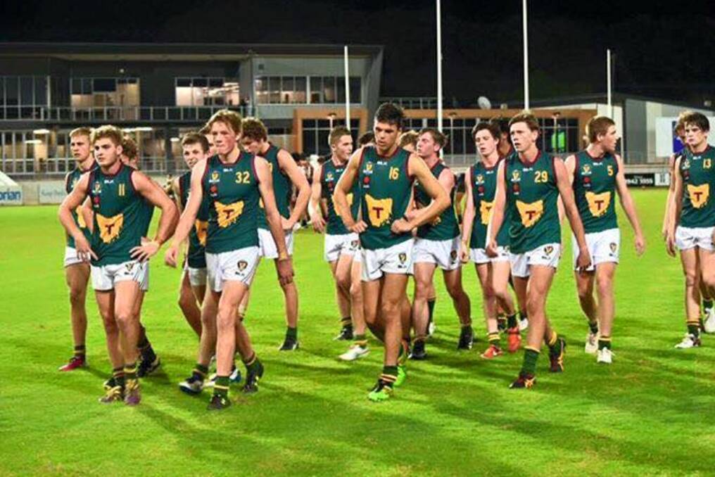 AT A LOSS: A despondent Tasmania walks off the ground in Darwin after a hefty defeat against the Northern Territory in the opening national under-18 championships match last month. Is this a sign of the future or a blip on the radar?
