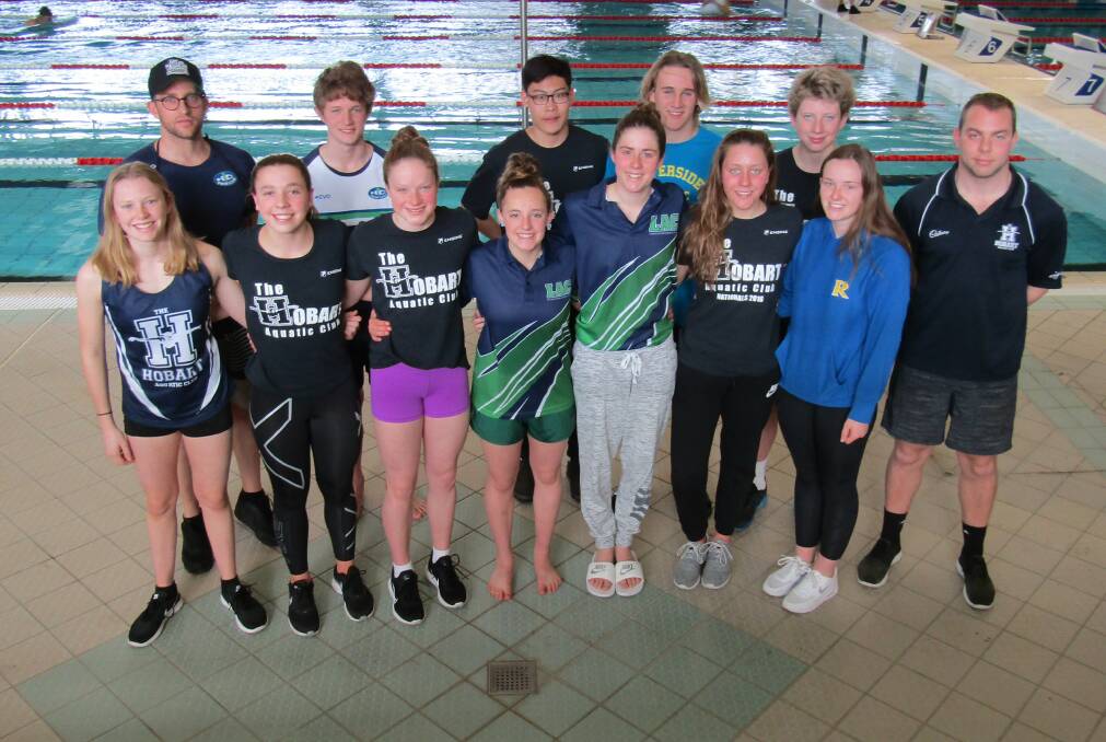 Team time: The Tasmanian swimming team competing in Canberra is, from left, Ella May, coach James McQueen, Lauryn Todorovic, Max Powell, Stefanie McCarthy, Jade Nichols, Yan'An Chen, Dawson Howell, Jordan Cooper, Mollie Bailey, Maximillian Giuliani, Emily Lonergan and head coach Paul Crosswell. Absent: Jonty Clues, Campbell Lane, Georgia Davis, Sophie Botterill-James. Picture: Wendy Shaw