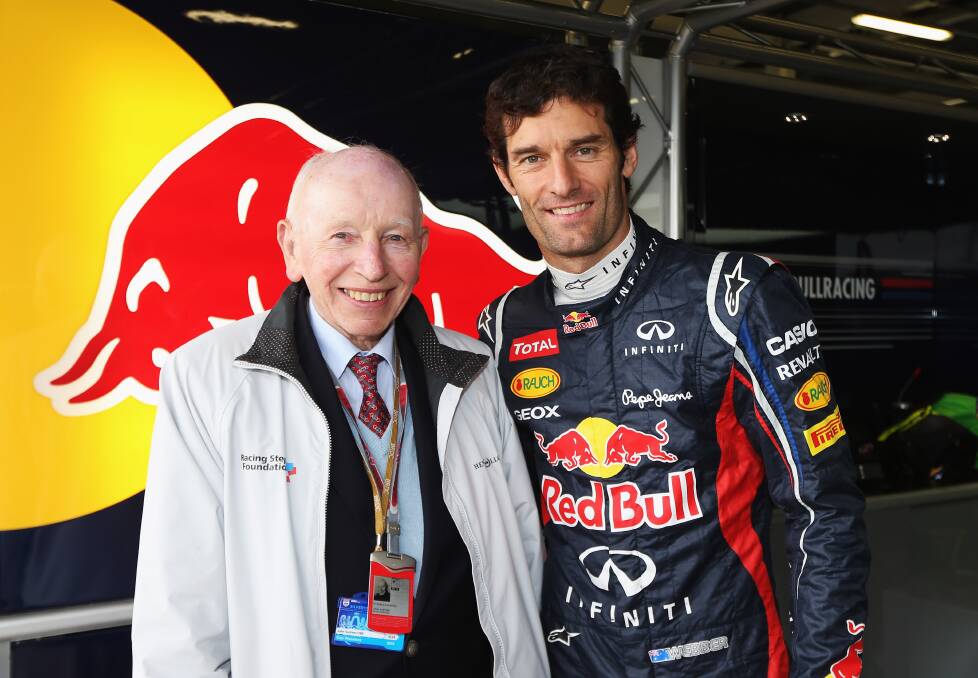 Surtees with former Australian Formula 1 driver Mark Webber before the British Grand Prix at Silverstone Circuit in 2012.