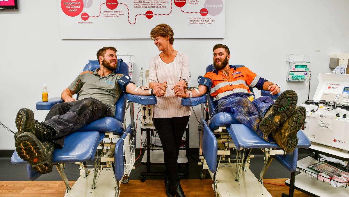Roll up your sleeves: Marja Garwood has made over 200 Red Cross Blood Donations, while her sons, Brad, 100 donations, and Nick, 50 donations, are doing their bit to help. Picture: Scott Gelston