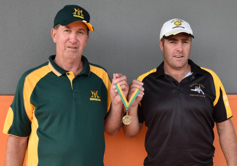 HONOUR: TCL president Darrell Whyte and Jason Savage hold up the Jason Savage Medal.