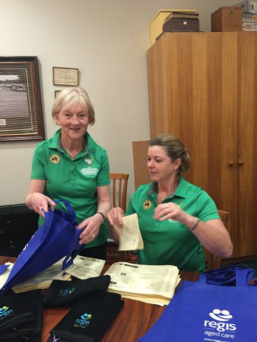 PREPARED: Committee members Sue Shea and Amanda Smith packwelcome bags ready for the influx of visitors. Picture: Supplied
