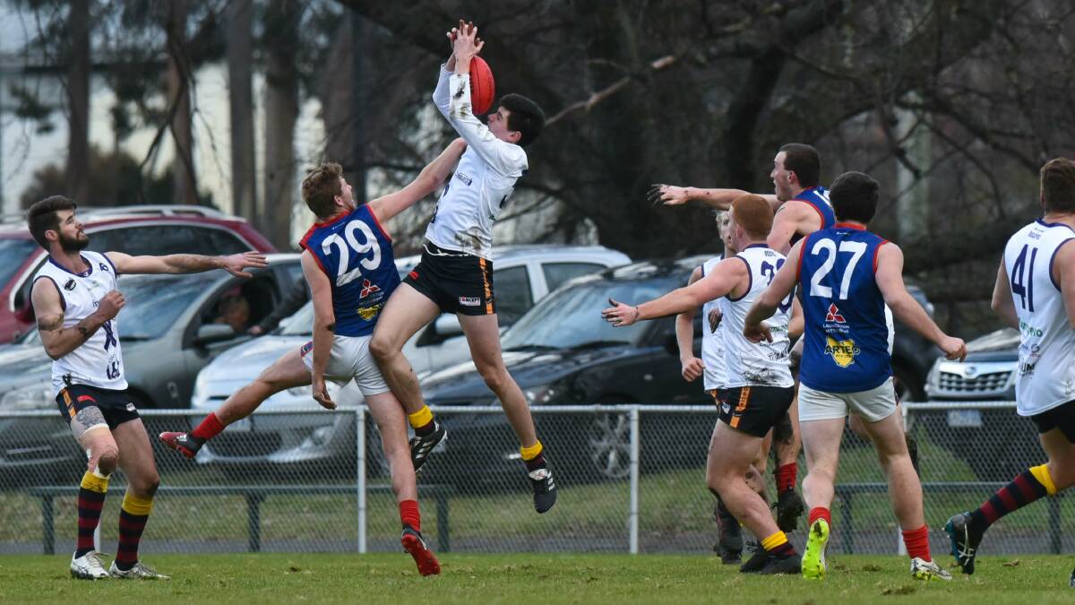 Lilydale's Billy Tuckerman and Old Scotch's Jackson Saggers in battle. Picture: Neil Richardson