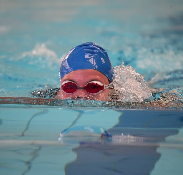 Charli Lloyd comes up out of the water in the grade 9 breaststroke.