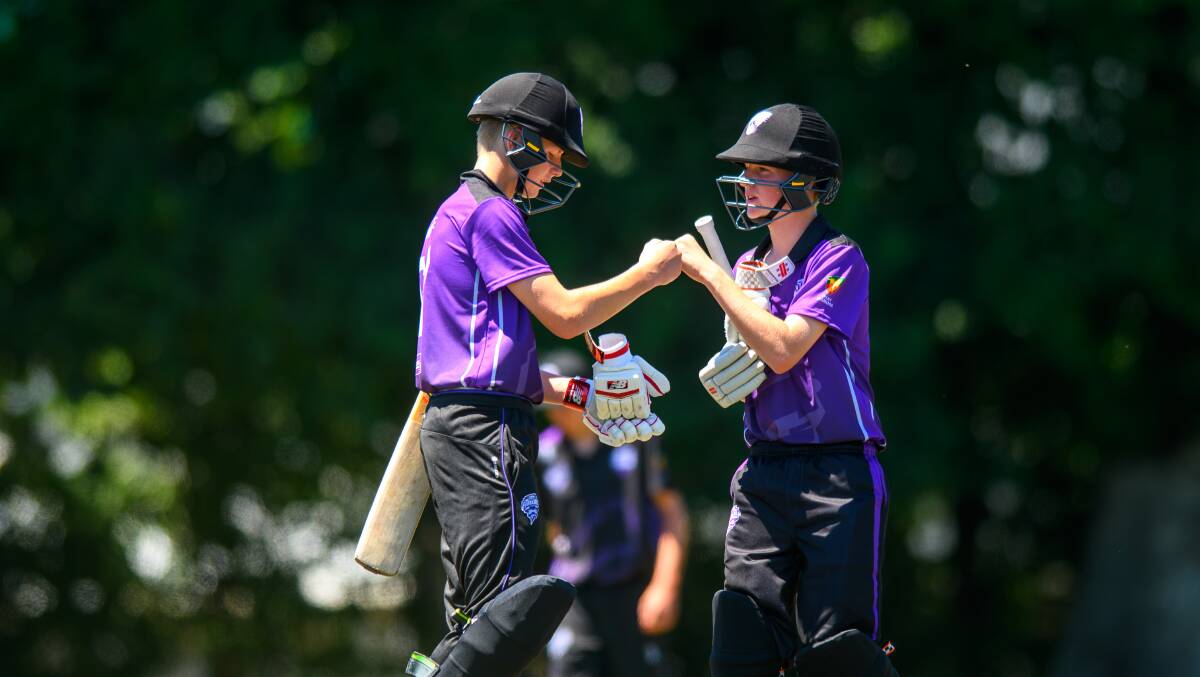 WELL DONE: Northern Force's James Simpson and Sam Freeman bump fists in the middle of NTCA No.1. Picture: Scott Gelston