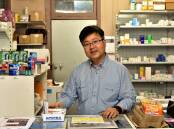 Trundle pharmacist Sam Lee will have to cut back his opening hours if fears the transition to 60-day prescriptions will slash his direct revenue by up to 40 per cent are true. Picture by David Ellery
