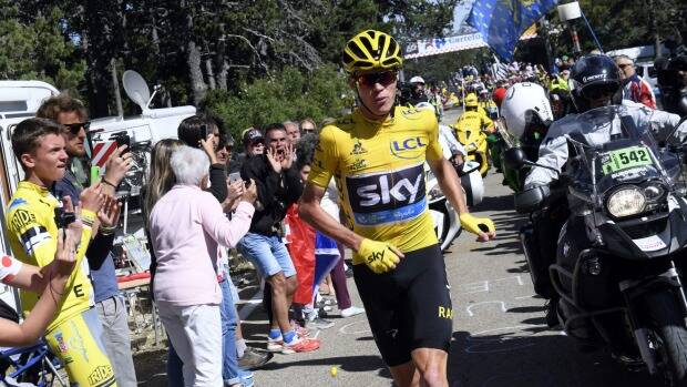 Britain's Chris Froome runs after he crashed at the end of the twelfth stage of the Tour de France. Photo: AP