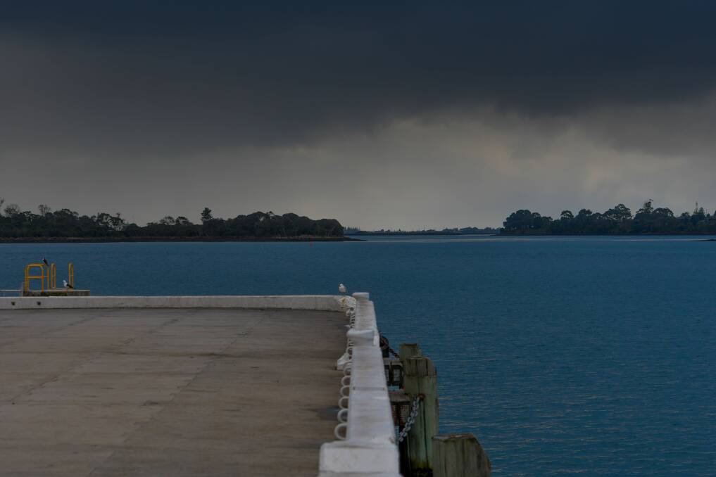 Rain clouds loom over the Tamar River at Beauty Point on Wednesday afternoon. Picture: Scott Gelston