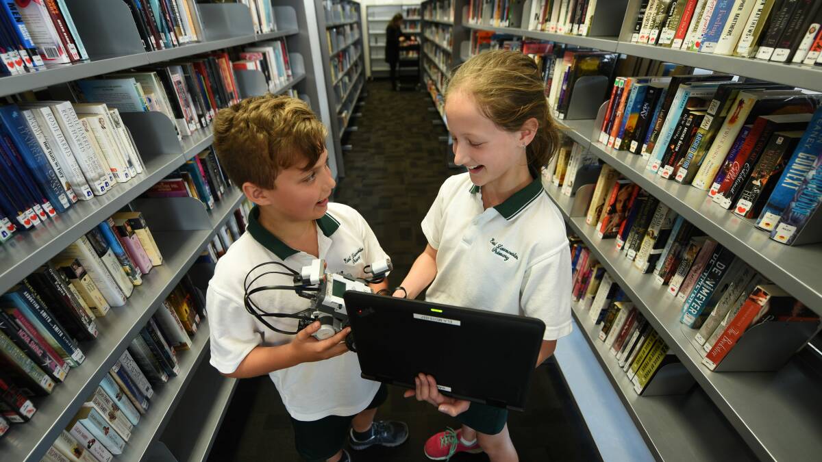 POP-UP CLASSROOM: East Launceston Primary School pupils Sam Huett and Amelia Reynolds spend the day learning at the Launceston LINC. Picture: Scott Gelston