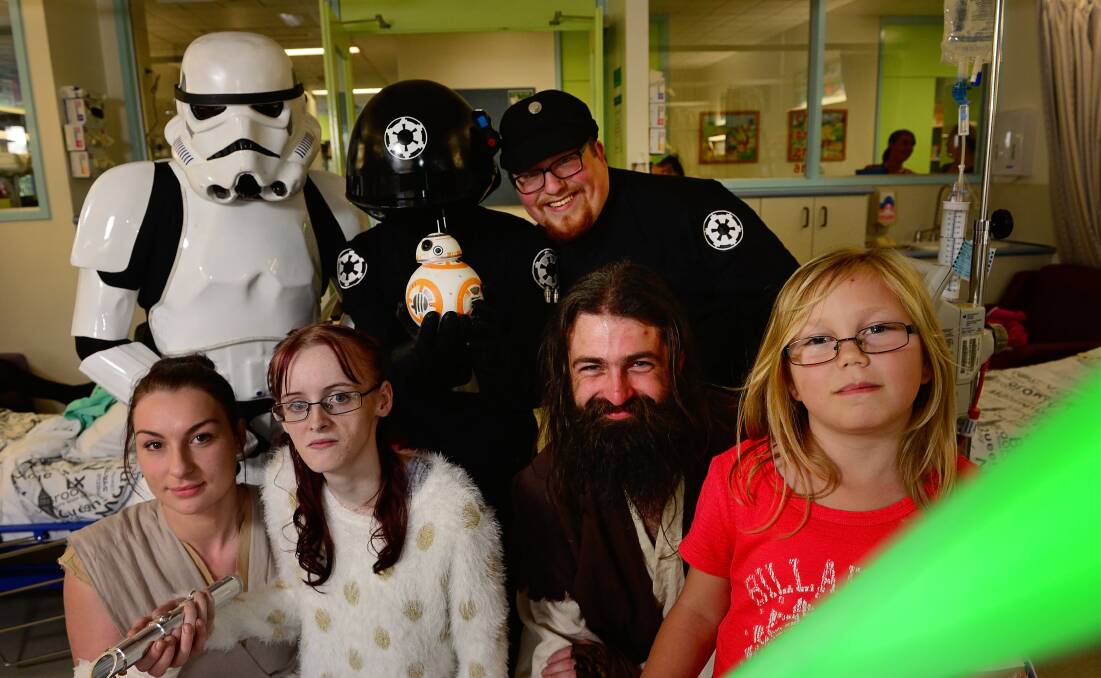 Shannon Cassidy and Grace Orchard met Jakku scavenger Rey (Bec Rossiter) and Jedi Dan Chugg, with Imperial stormtrooper Lee Moore, Death Star gunner Sam Carriere and Imperial crew Ezra de Vos. Picture: Phillip Biggs