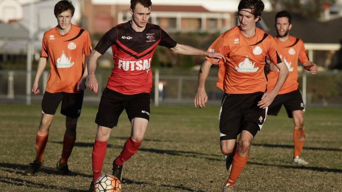 Riverside attempt to run down Ulverstone's Timothy Read in the Northern Championship clash at Ulverstone. Pictures: Brodie Weeding