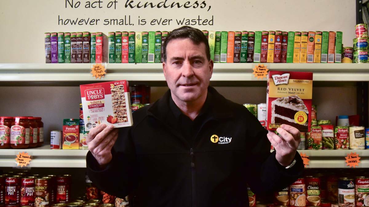 City Mission chief executive Stephen Brown with some of the non-perishable products the service is seeking. Picture: Neil Richardson