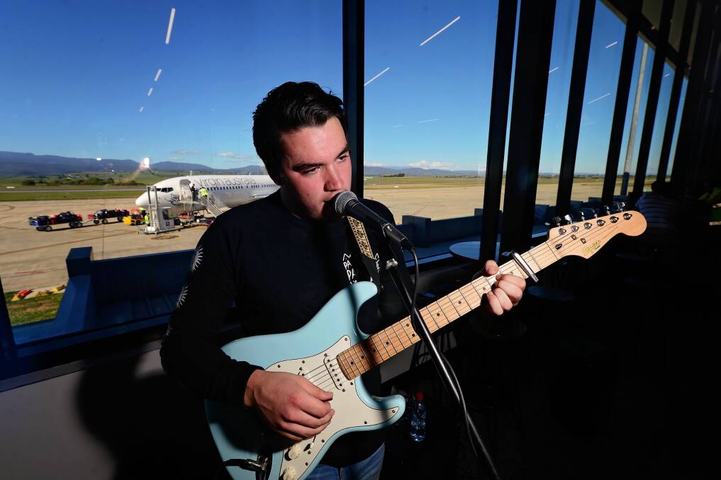 LIVE: Trent Buchanan plays at the Launceston Airport on Friday. Picture: Phillip Biggs
